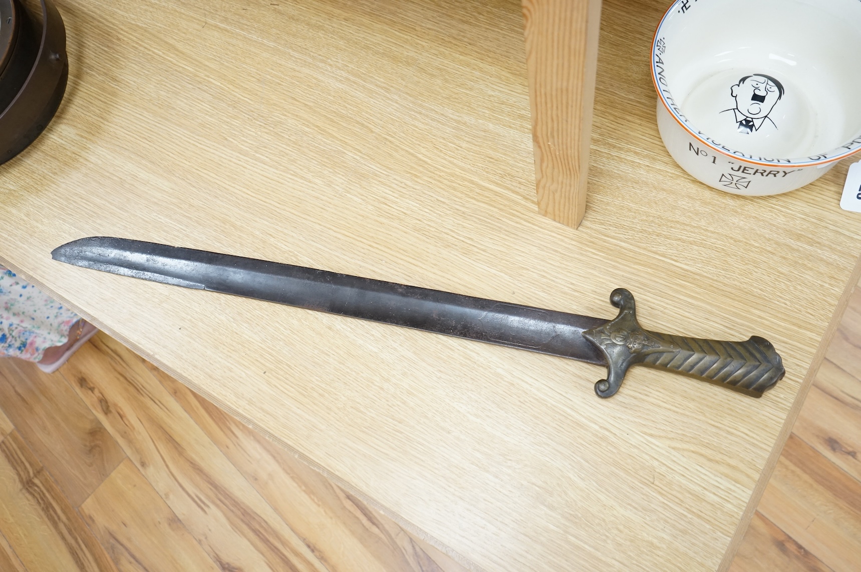 A scarce Germanic Janissary Corps sidearm, produced from 1729-31, broad single edged blade, 65cm, etched in panel with crowned cipher (faint), regulation cast brass hilt with crowned cipher and chevron grip